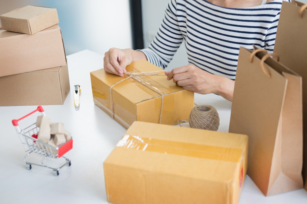 Business owner woman prepare product packaging - Photo, Image