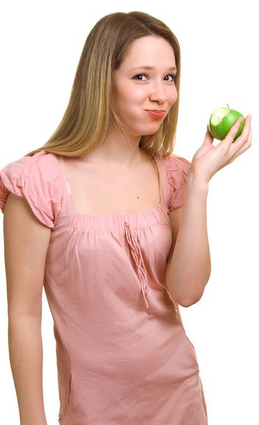 Girl eats a green apple - Photo, Image