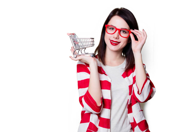 Woman in glasses with shopping cart  - Photo, Image