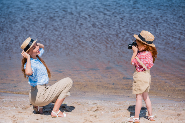 child photographing mother near sea - Photo, Image