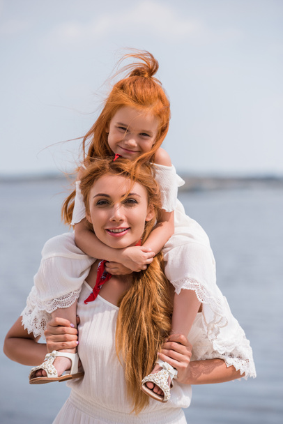 mother and daughter at seashore - Photo, Image
