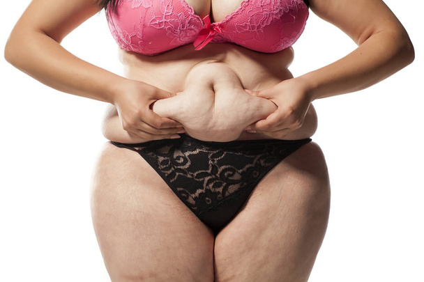 fat on her stomach - Foto, Imagen
