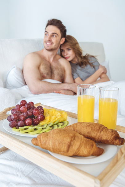 couple with breakfast in bed - Photo, Image