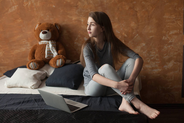 Girl with laptop and toy - Photo, Image