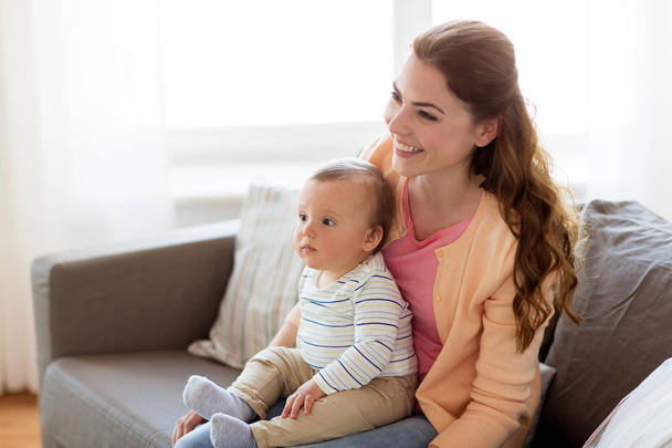 happy young mother with little baby at home - Valokuva, kuva