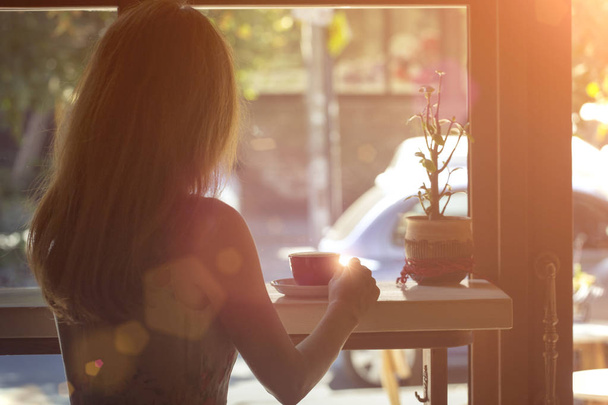 girl sitting with  cup of coffee  - Φωτογραφία, εικόνα