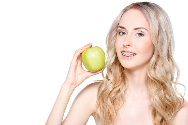 Woman holding apple in hand - Foto, Bild