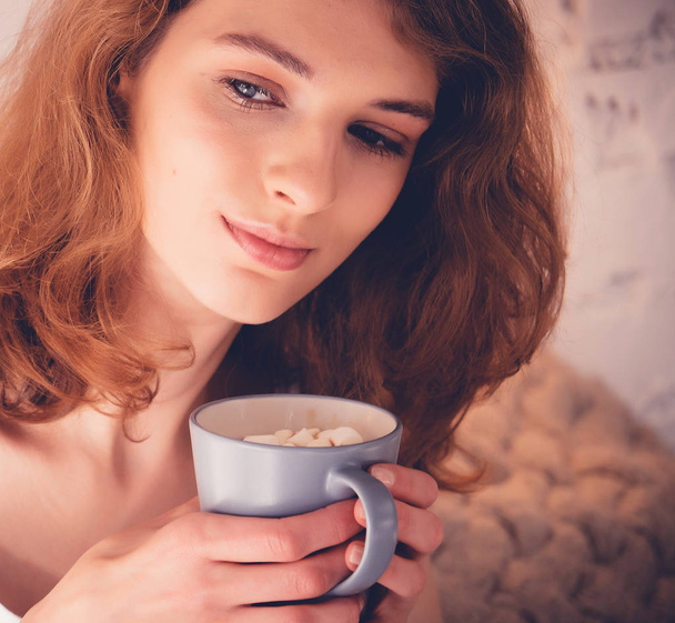 Beautiful woman drinking a coffee in her bed. Lifestyle concept. - Foto, Imagem