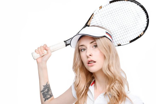 молода жінка з тенісною ракеткою
 - Фото, зображення