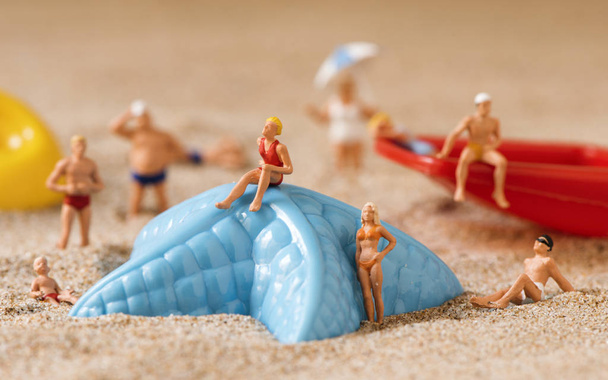 miniature people in swimsuit on the beach - Photo, Image