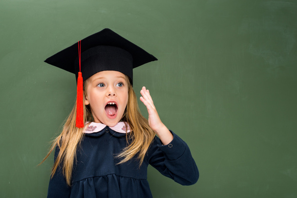 shouting schoolgirl in graduation hat - Foto, Imagem