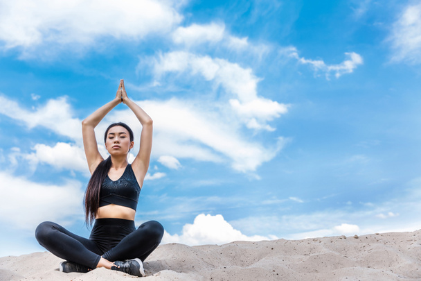 woman meditating in lotus yoga pose - Photo, Image
