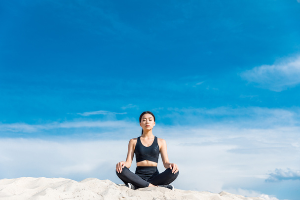 woman meditating in lotus pose - Photo, Image