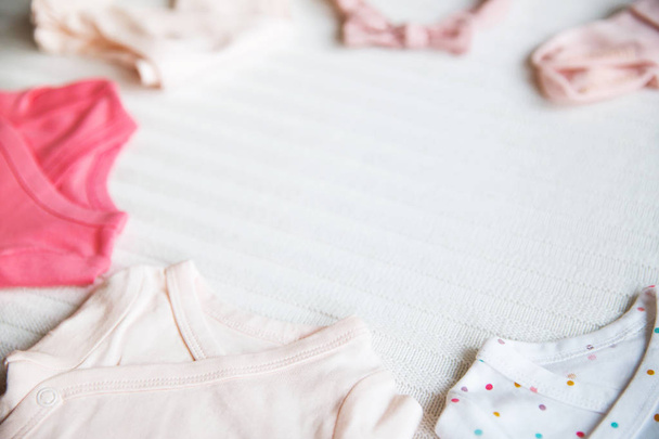 Baby girl clothes. Fabric background.  - 写真・画像