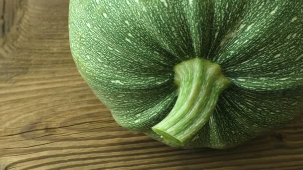 Fresh zucchini on wooden background. Zucchini on wooden table. - Footage, Video