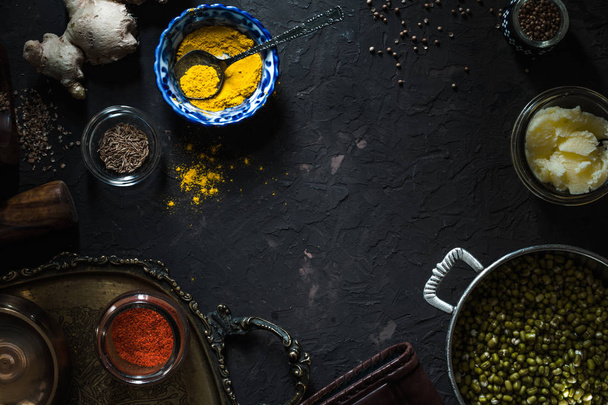 Ingredients of Indian cuisine on the dark background top view - Fotó, kép