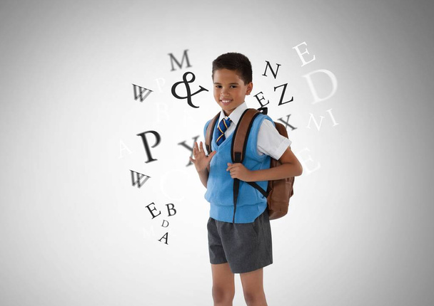 Many letters around schoolboy - Foto, imagen