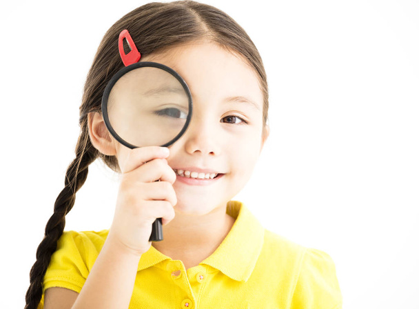 happy little girl with magnifying glass - Foto, Bild