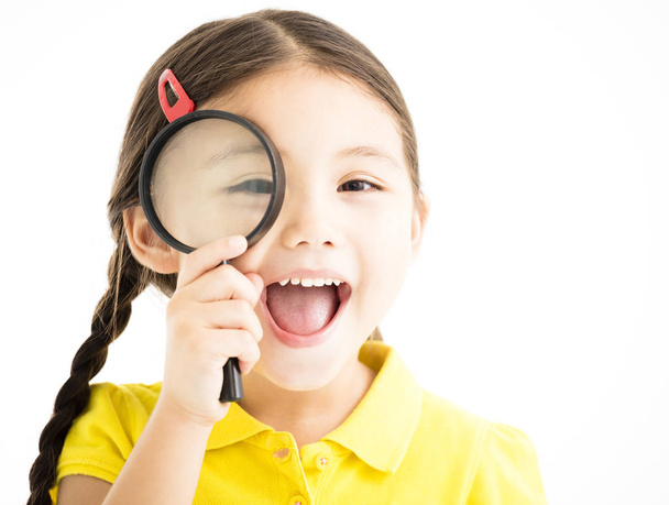 happy little girl with magnifying glass - Foto, Bild