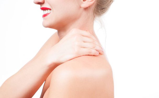Woman has neck pain. Nude shoulders girl from the back. - Foto, imagen