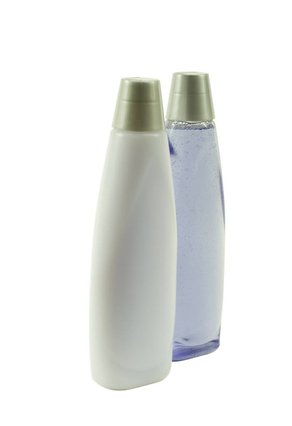 Due bottiglie di shampoo blu; Vista ad angolo
 - Foto, immagini