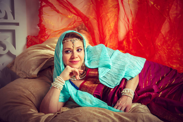 Beautiful pregnant girl in traditional Indian clothes. - Photo, image