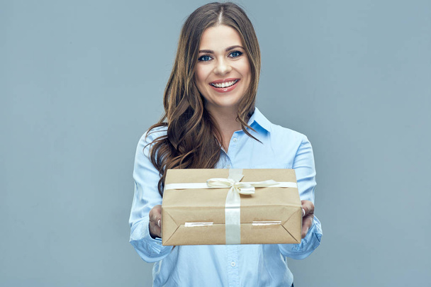 woman in shirt holding gift box - Фото, изображение