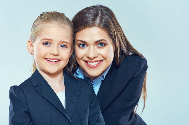 smiling businesswoman hugging daughter - Fotografie, Obrázek
