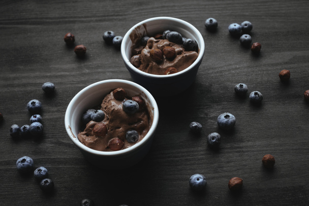 chocolate ice cream with blueberries and hazelnuts - Photo, Image