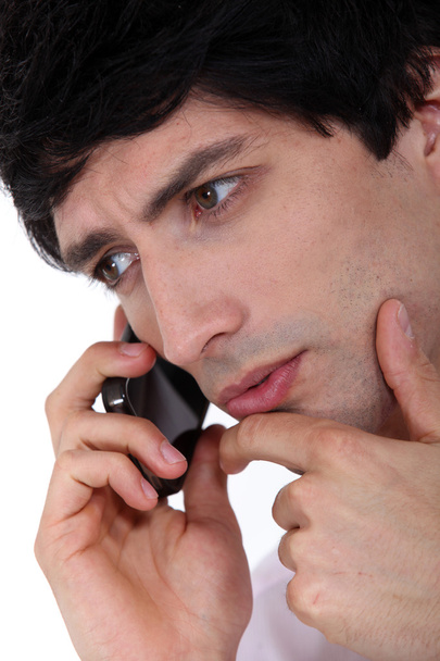 Closeup of young man talking on the phone - Foto, Bild
