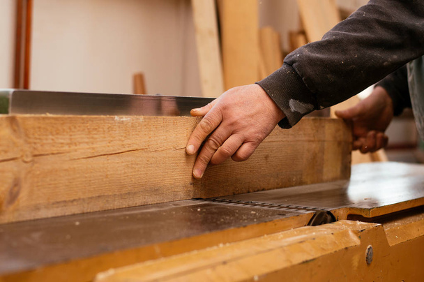 Carpenter working with wood  - Foto, Bild