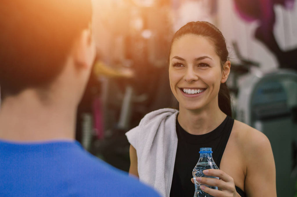 Woman talking to fitness trainer   - Foto, Imagem
