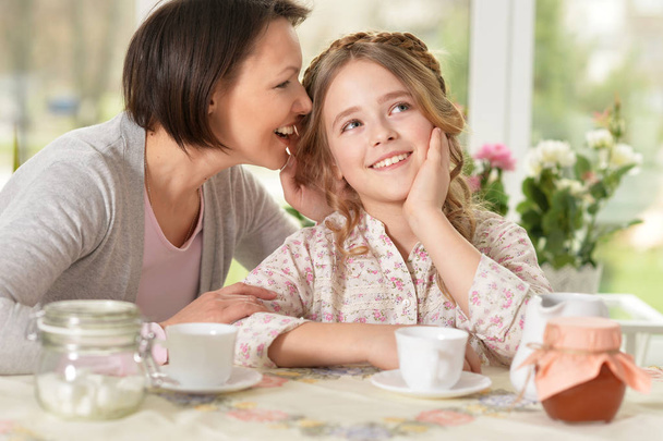 Mother and daughter drinking tea - Photo, image