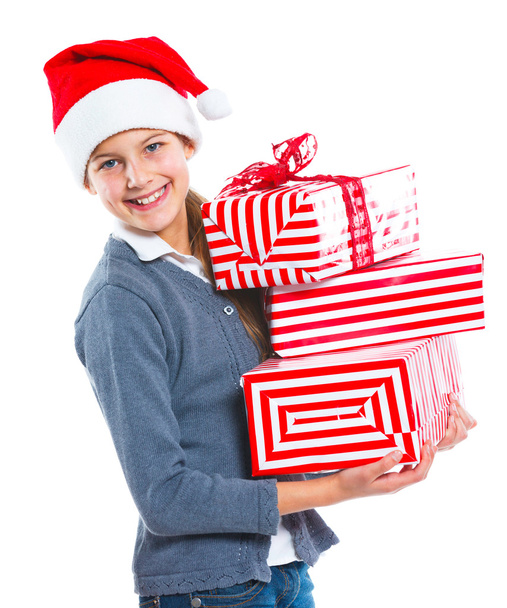 Cute girl in Santa's hat with gift box - Foto, afbeelding