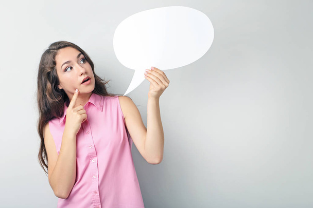 Young woman with speech bubble - Photo, image