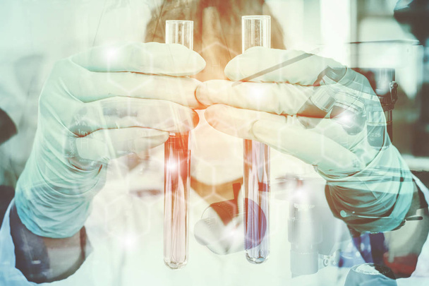 Double exposure of science experiment  hand holding test tube - Foto, Imagem