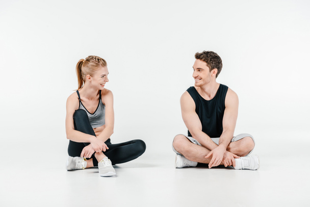 fit couple relaxing on floor - Photo, Image