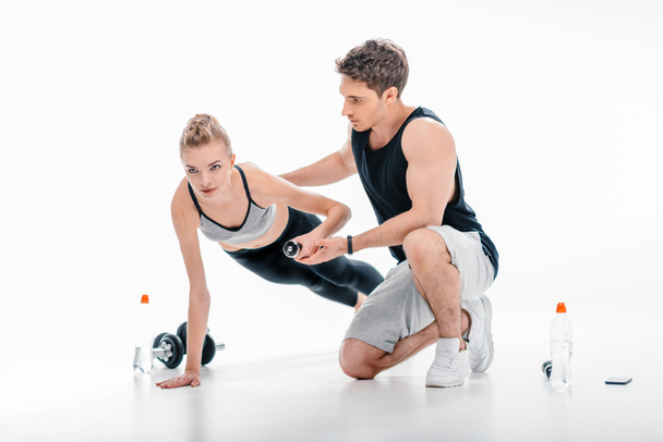girl doing exercise with trainer - Photo, Image