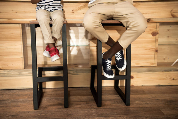 father and son sitting on stools - Photo, Image