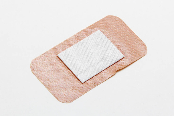 Medical adhesive plaster on white background - Foto, immagini