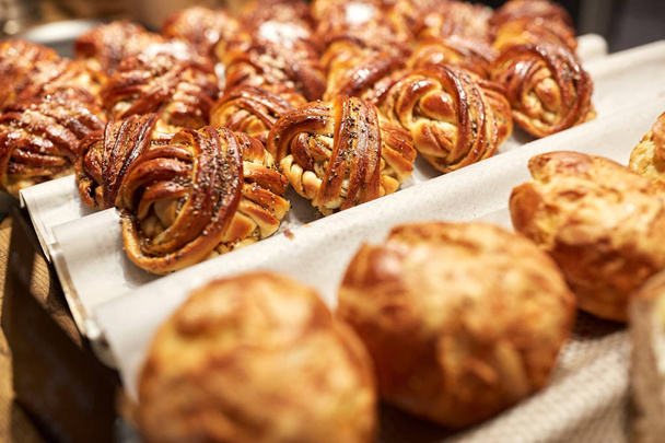 close up of buns or pies at bakery - 写真・画像