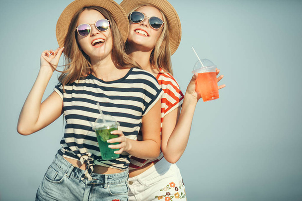 Portrait of two young beautiful girls in trendy stripe shirt, be - Foto, immagini