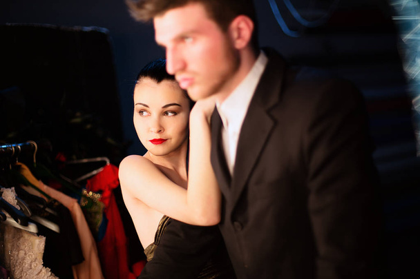 Model girl and her boyfriend at make up room after show she took part in - Photo, Image