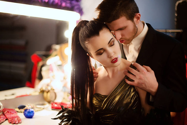 Model girl and her boyfriend at make up room after show she took part in - Foto, Imagem