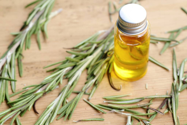 rosemary herbs with oil - Фото, изображение