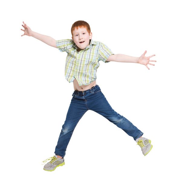 Happy laughing boy jumping on white isolated background - Photo, Image