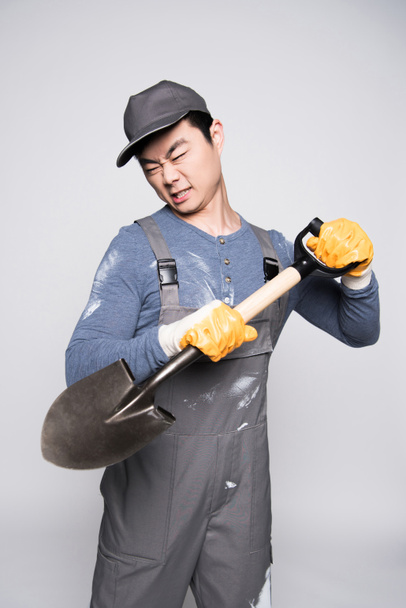 Construction worker swinging a shovel  - Photo, Image