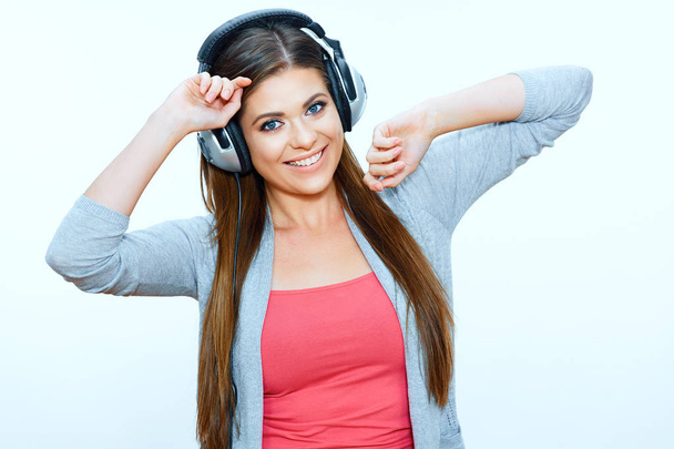 Smiling girl casual wearing with headphones listen music - Zdjęcie, obraz
