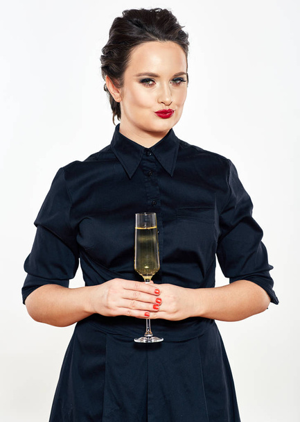 young woman in evening black dress hold wine glass. female model - Foto, afbeelding