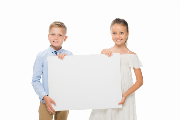 siblings with empty board - Фото, изображение